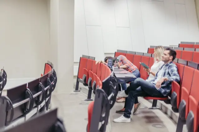 Students sitting in a university amphitheatre