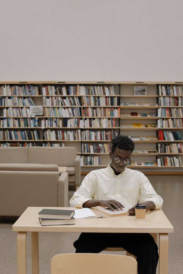 Man sitting at a library desk